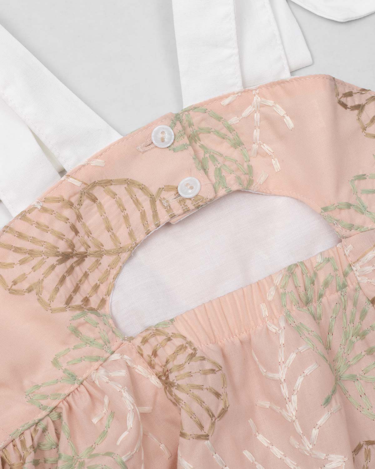 Dress with delicate leaf embroidery and white bow straps