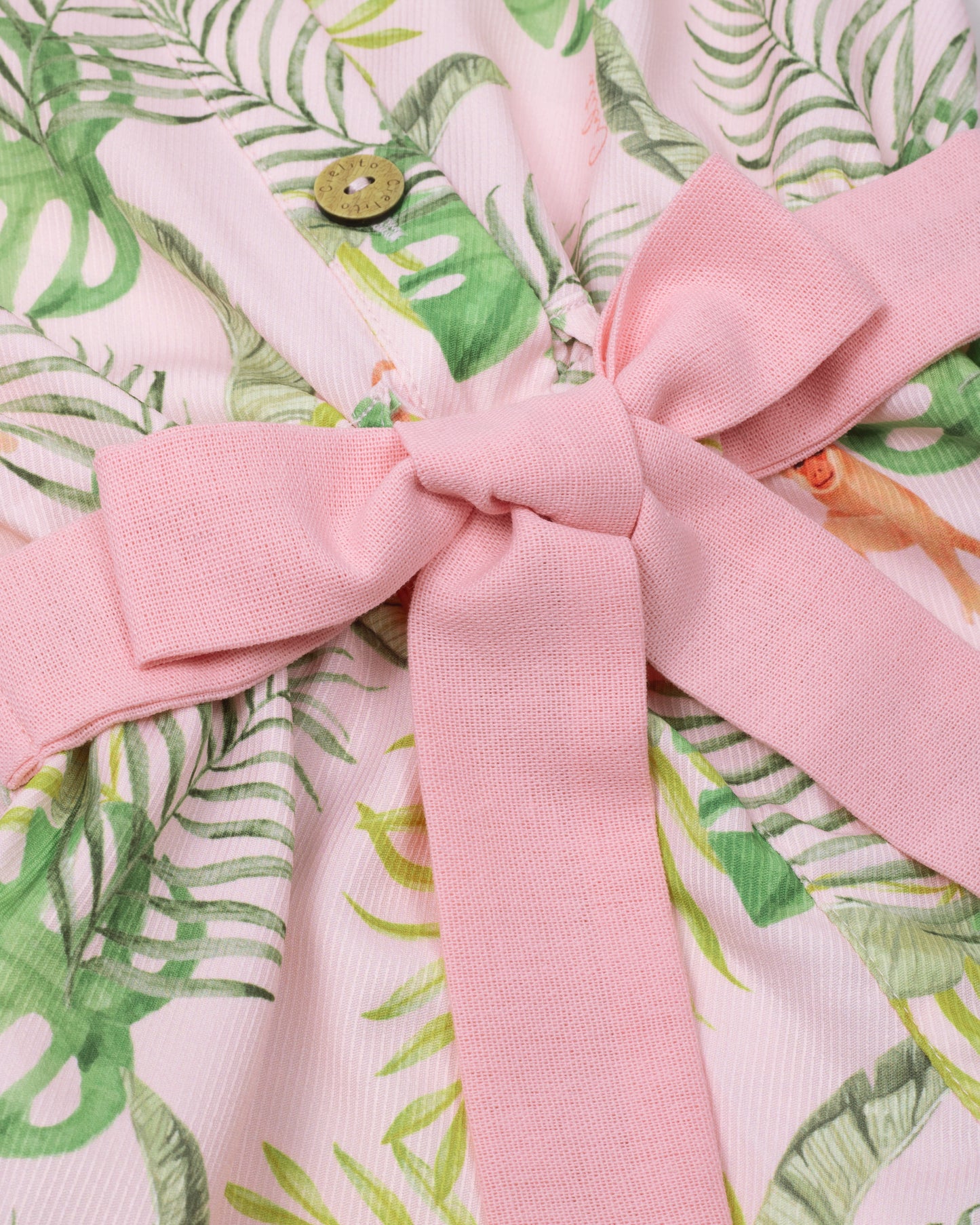 Floral romper with delicate pink belt