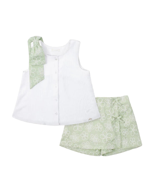 White sleeveless top with matching green floral skort