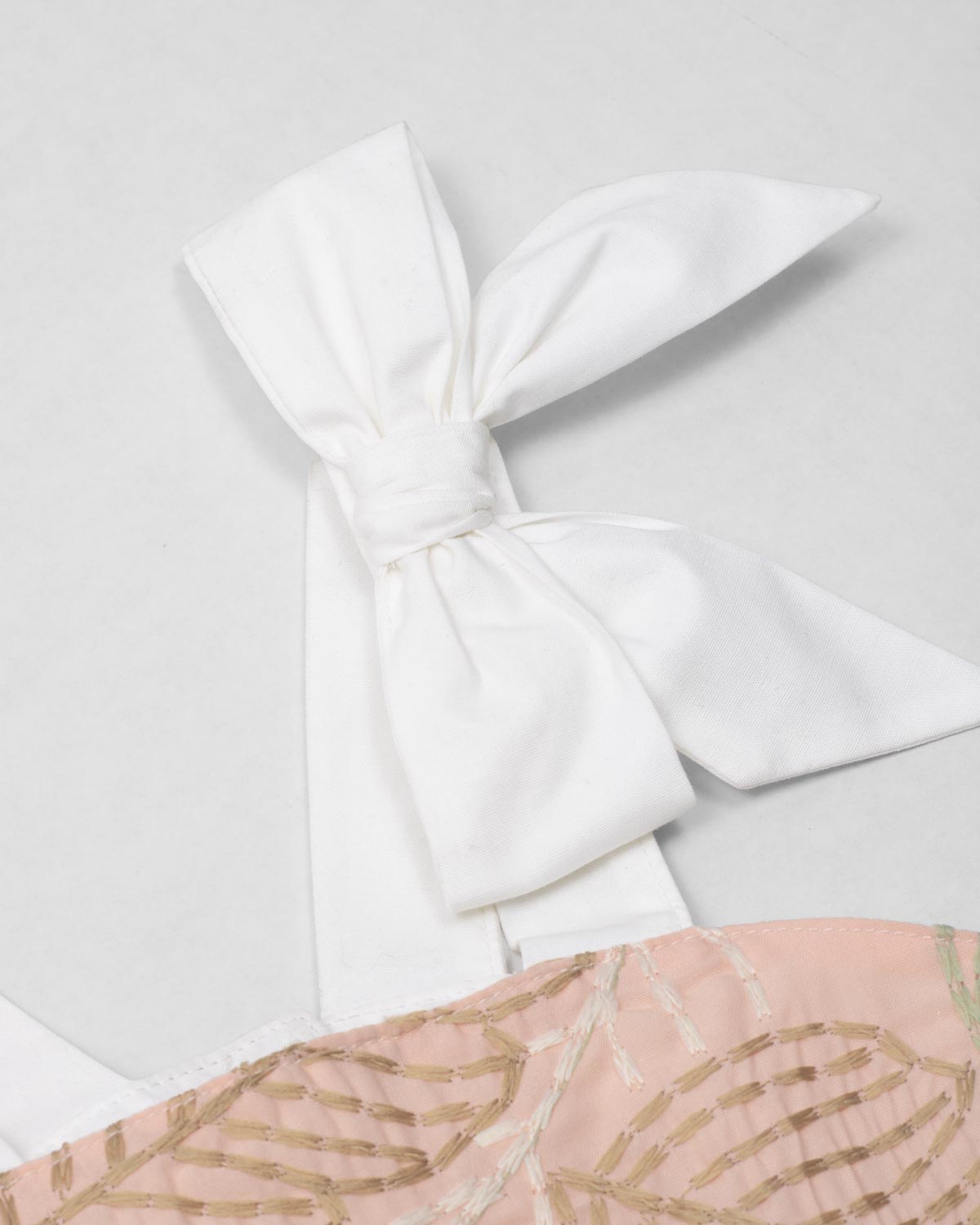 Dress with delicate leaf embroidery and white bow straps