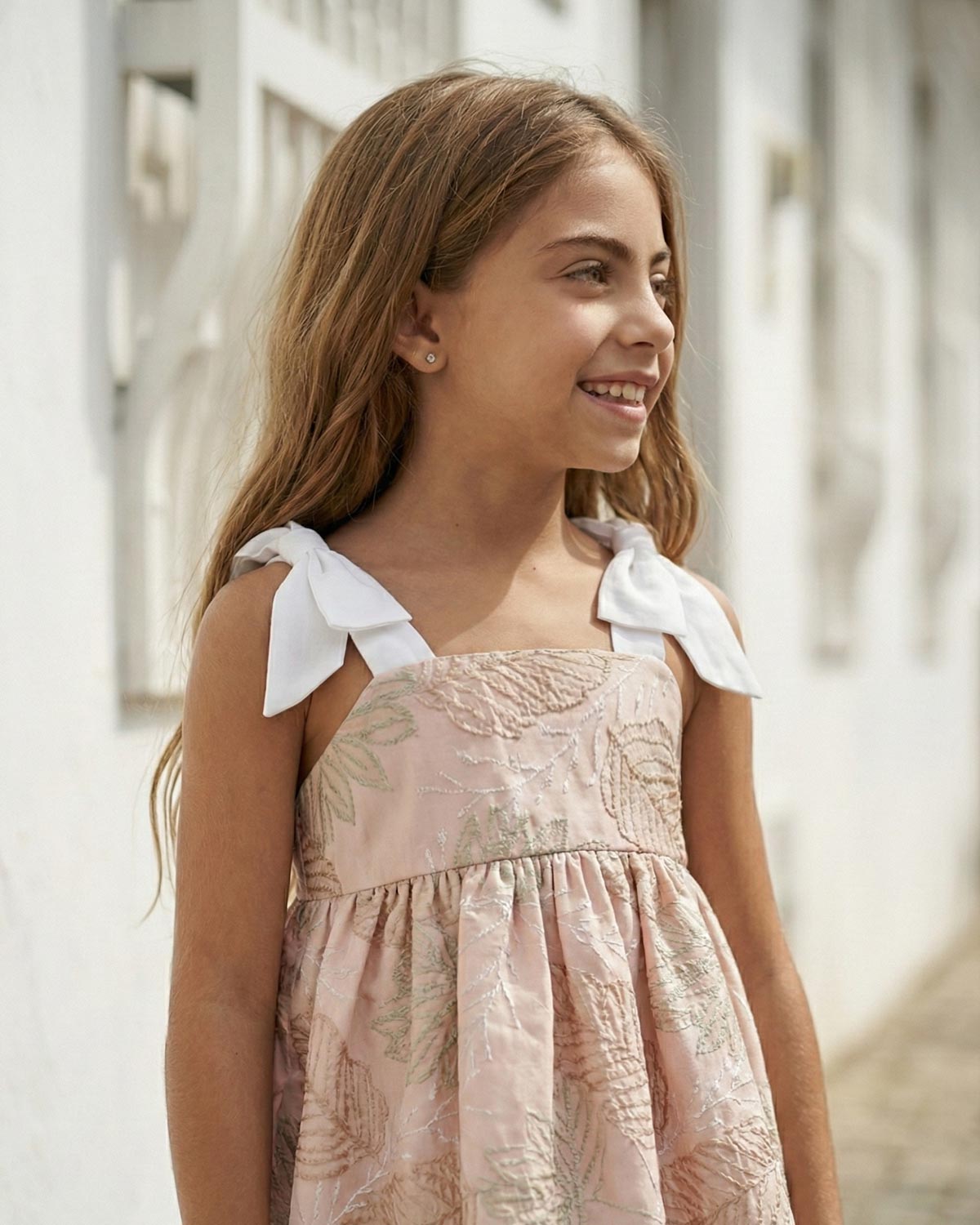 Dress with delicate leaf embroidery and white bow straps