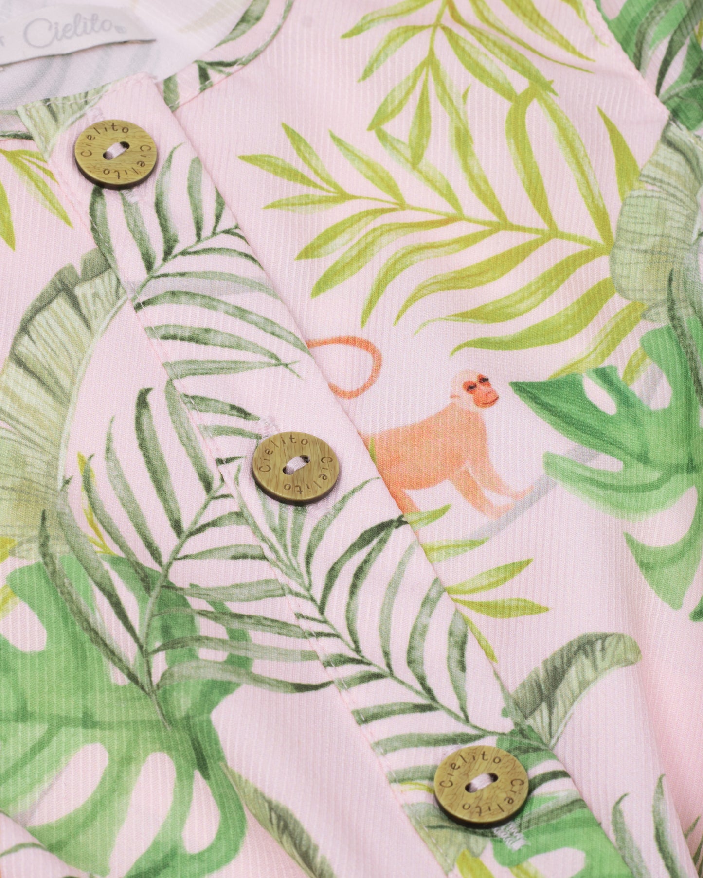 Floral romper with delicate pink belt