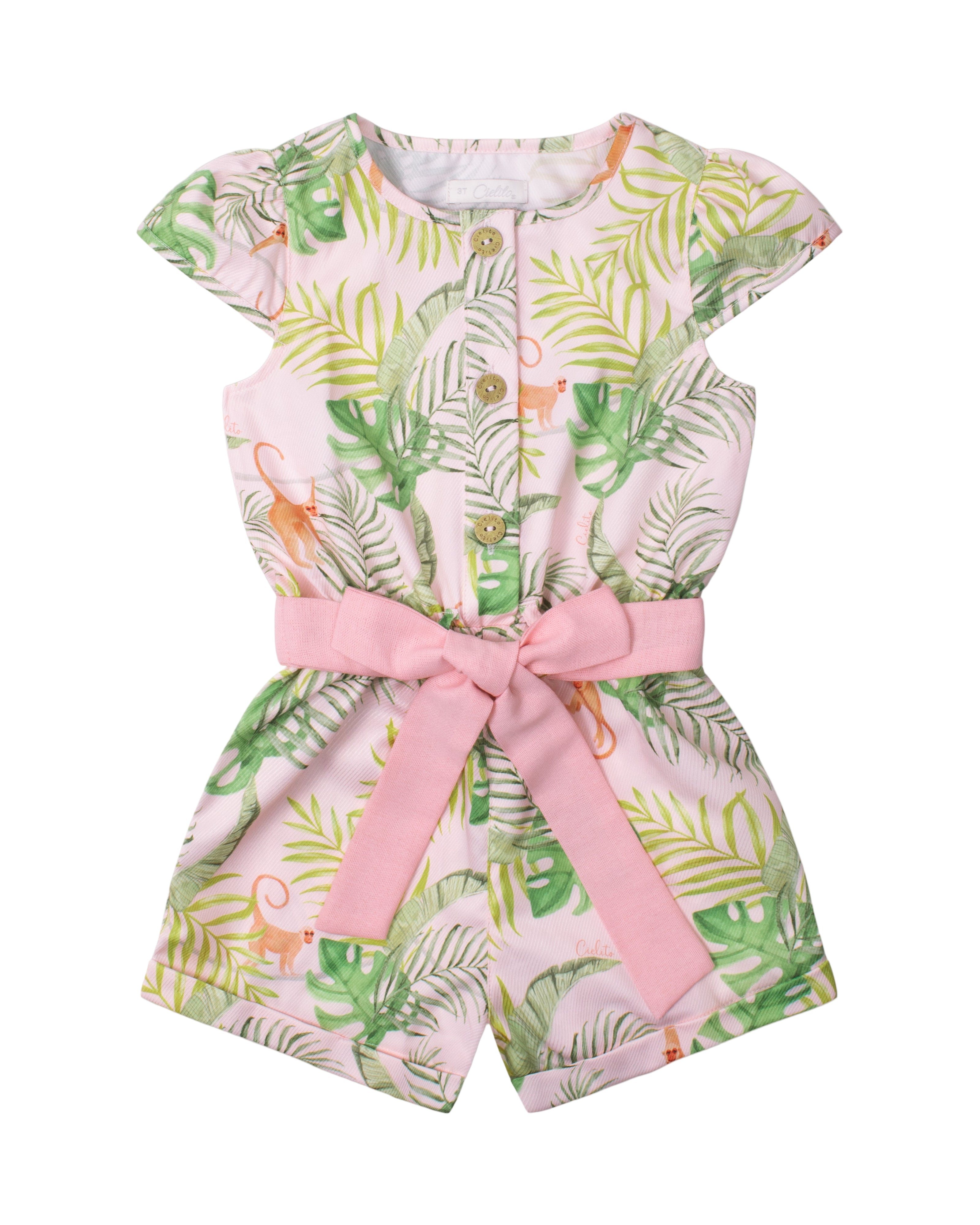 Girl's floral romper with tropical leaf pattern and a pink belt 