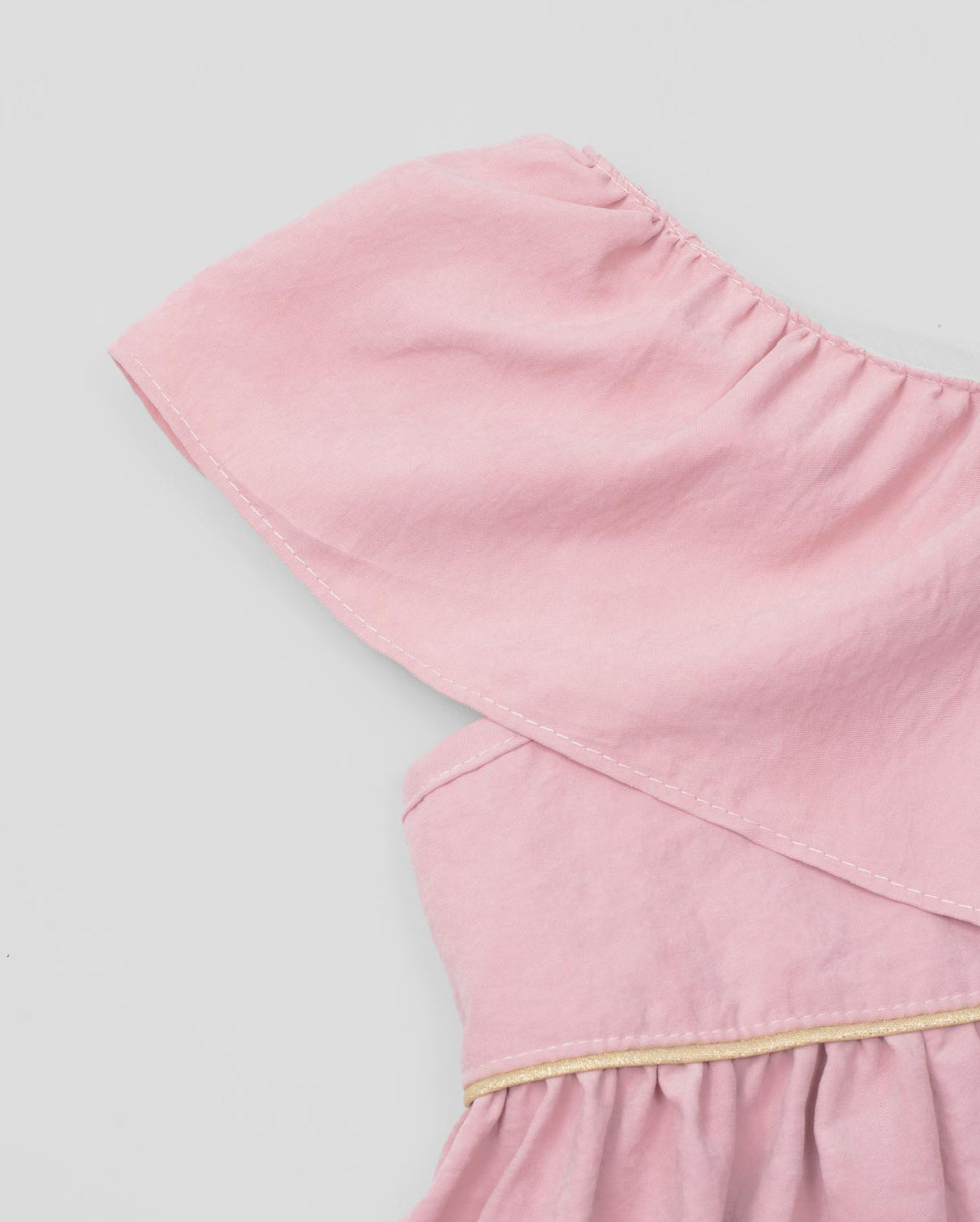 Pink dress with a wrap bolero, bow detail strap, and side button fastening for girls